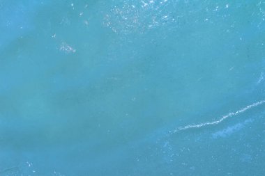 Close up photo texture of highlighted and frozen water surface.