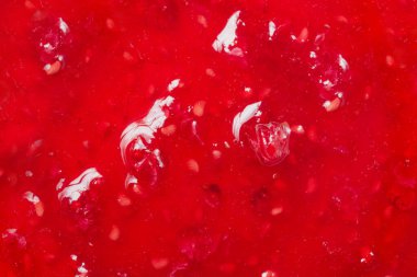Close up photo texture of fruit raspberry jam.