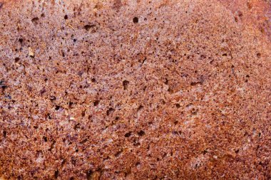 Close up photo texture of baked rye bread.