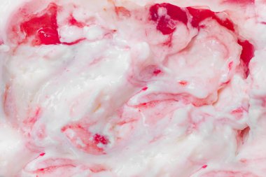 Close up photo texture of yoghurt snack with jam.