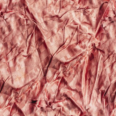Mercan rengi buruşuk ipek ya da saten kumaş kumaşının kusursuz desenli fotoğrafı..
