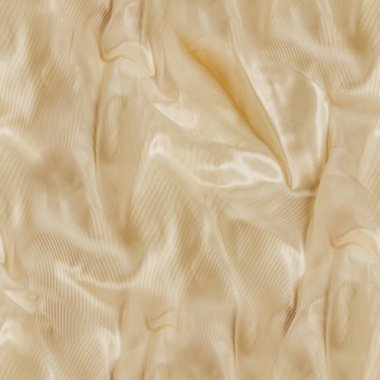 Bej renkli buruşuk ipek ya da saten kumaş kumaşının kusursuz desenli fotoğrafı.