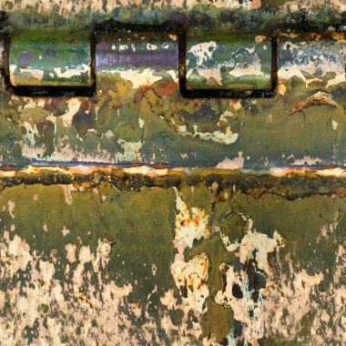 Paslı ve yıpranmış menteşeli zırhlı araç yüzeyinin kusursuz desenli fotoğrafı..