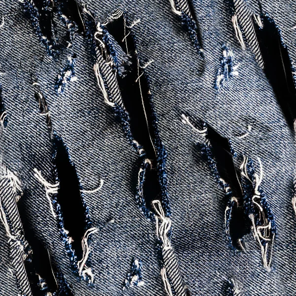 青い着色された引き裂かれたデニムまたはジーンズ材料の継ぎ目が無い質の写真 — ストック写真