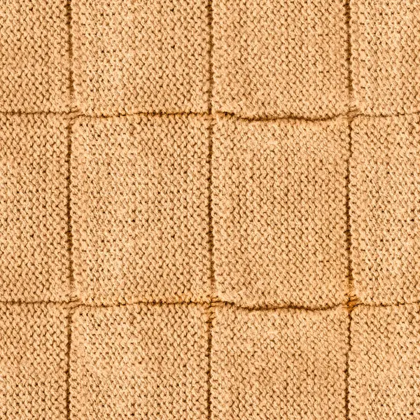 Açık kahverengi ya da fildişi renginde örülmüş ve dikişli yün kumaştan pürüzsüz 4k fotoğraf dokusu..