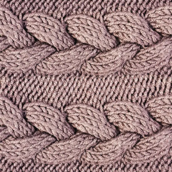 Kahverengi renkli süslemeli ve desenli yün kazak kumaşının kusursuz 4k fotoğraf dokusu.