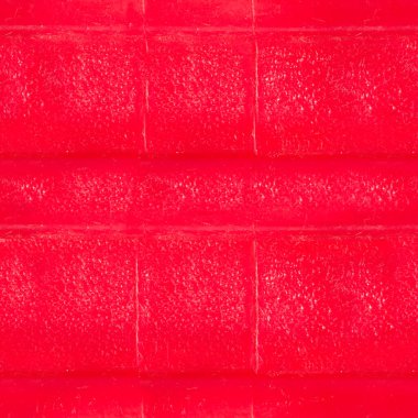 Kırmızı renkli yıpranmış plastik yüzeyin kusursuz 4k fotoğraf dokusu..