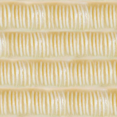 Bej renkli tırtıklı plastik yüzeyin kusursuz 4k fotoğraf dokusu malzemesi.