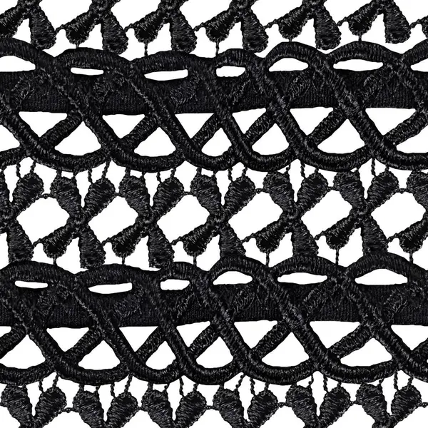 Siyah süslemeli siyah dantel örgünün izole edilmiş 4k dokusu beyaz arkaplanda.