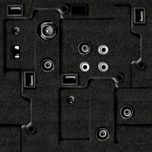 Kablo bağlantı delikleriyle siyah renkli plastik panel yüzeyinin kusursuz 4k fotoğraf dokusu materyali.