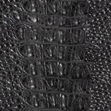Siyah renkli sürüngen ya da timsah desenli kabartmalı deri yüzeyin kusursuz 4k fotoğraf dokusu..