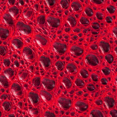 Kırmızı renkli kabartmalı sürüngen ya da yılan derisi deri yüzeyinin kusursuz 4k fotoğraf dokusu..