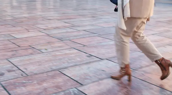 stock image Rush people. Blurred motion of person in mid-stride on a tiled floor, showcasing lower half clad in light trousers and brown shoes. High quality photo