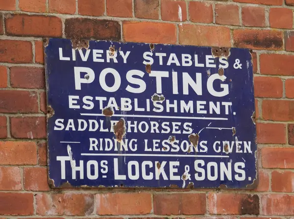 stock image Beamish, Durham, Newcastle, UK. July 2024. Metal wall mounted advertising sign.