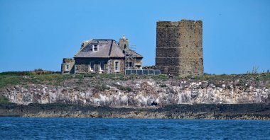 The Farne Islands are a group of islands off the coast of Northumberland, England. The group has between 15 and 20 islands depending on the level of the tide. clipart