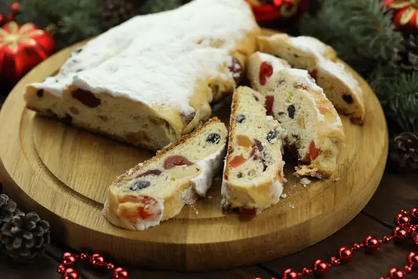 traditional stollen with decoration on wooden background