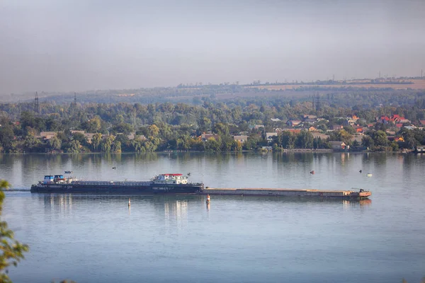 empty dry-cargo ship sailing on the river