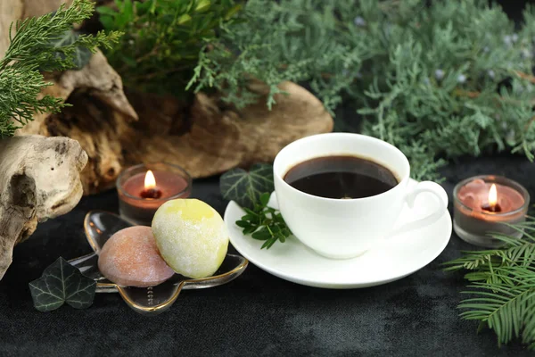 Cup of hot coffee with japanese sweets daifuku mochi