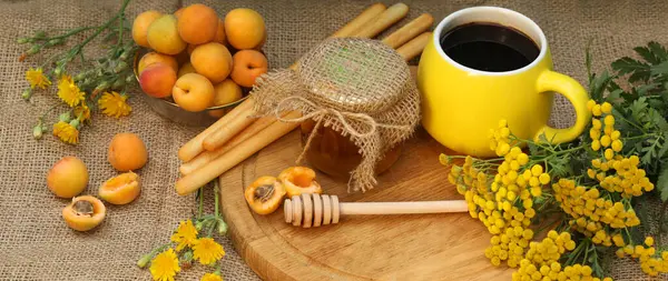 stock image Summer still life picture with coffee, honey, apricots and yellow flowers