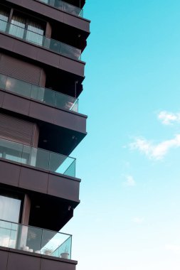 Highrise building with a blue sky background. Apartment residential house and home facade architecture