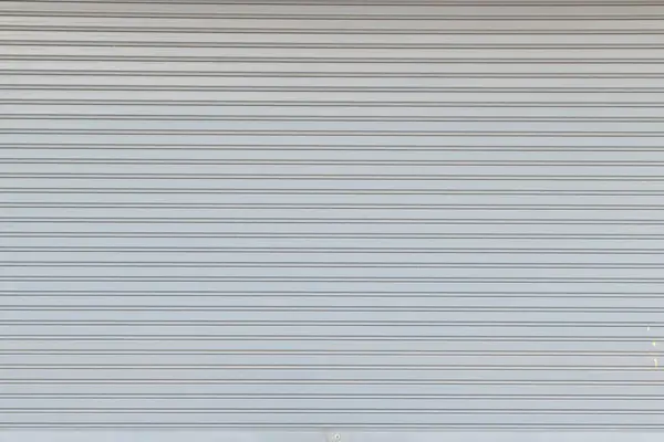 Vehicle roller door texture. Slide door shutter background. Galvanized sheet metal texture