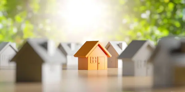 以绿色自然背景为背景的带小木屋的房屋建筑的房地产业概念 3D渲染 免版税图库照片
