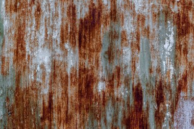 Weathered rusty metal surface with vertical corrosion patterns. clipart