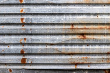 Çürümüş çelik yüzeyi ve endüstriyel bozunması olan paslı metal dokusu..