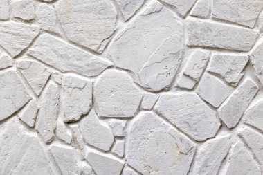 Düzensiz beyaz desenli desenli doğal taş duvar.