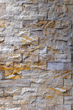 Doğal desenleri ve renkleri olan desenli taş duvar..