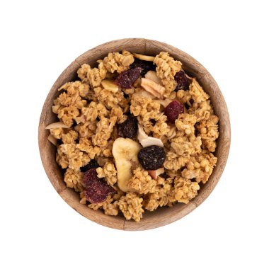 Tahta kasede gevrek gevrek, beyaz, fındıklı müsli yığını, kızılcık ve kuru üzümler kapalı, sağlıklı beslenme konsepti.