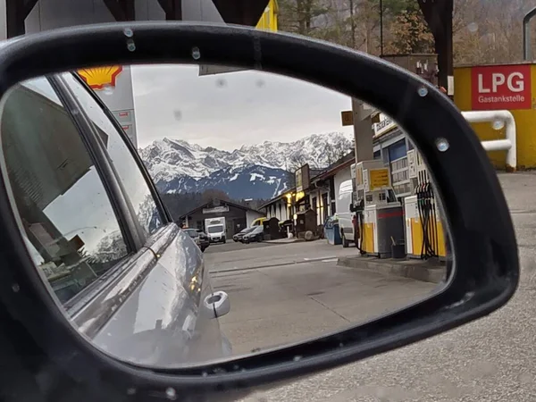 view of the city of car mirror in the alps. germany