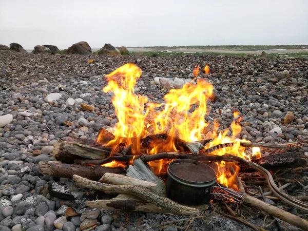 camping and drinks, coffee on the fire