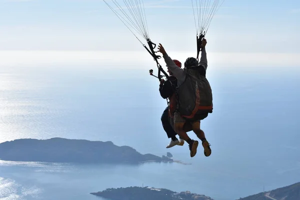 paragliding in montenegro. man flying in the sky