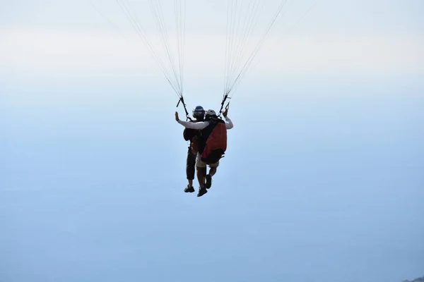 paragliding in montenegro. man flying in the sky