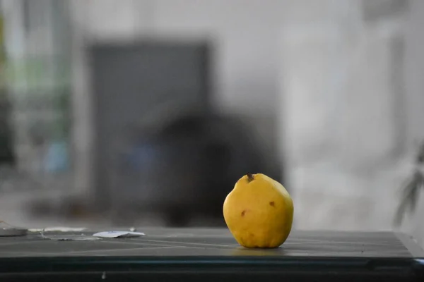 yellow ripe pear on the table in the garden