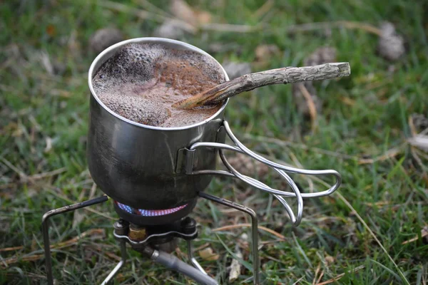 hot coffee on a background in the garden