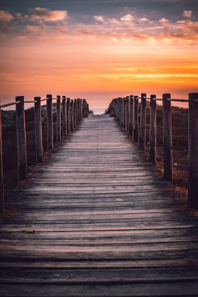 Strolling into the Sunset: A Boardwalk to the Beach