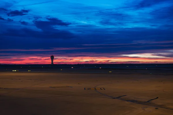 beautiful sunrise in an airport. sunset at airport with control tower