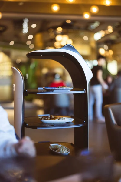 robot waiter serving food in a restaurant