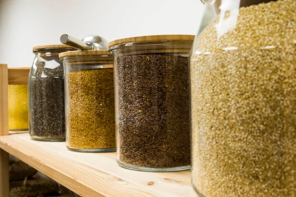 stock image Self service bulk organic food. Eco-friendly zero waste shop. Small local business. Quinoa, chia, golden linen and brown linen.