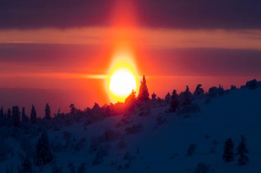 Winter sunset in Pallas Yllastunturi National Park, Lapland, northern Finland.