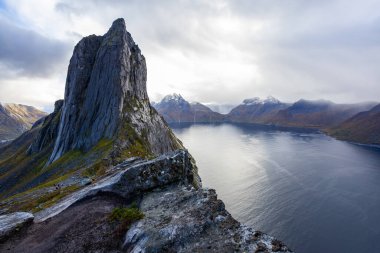 Stunning autumn landscape of Segla Mountain in Senja Island, Norway, with dramatic cliffs and fjords. clipart