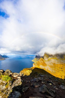 Stunning autumn landscape of Segla Mountain in Senja Island, Norway, with dramatic cliffs and fjords. clipart