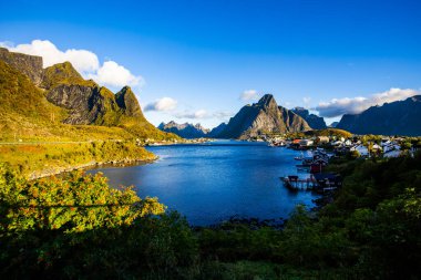 A beautiful sunrise over the picturesque village of Reine in Lofoten Islands, Norway. clipart