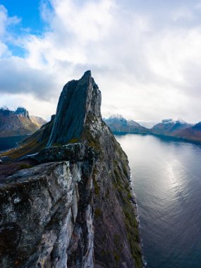 Stunning autumn landscape of Segla Mountain in Senja Island, Norway, with dramatic cliffs and fjords. clipart