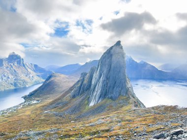 Stunning autumn landscape of Segla Mountain in Senja Island, Norway, with dramatic cliffs and fjords. clipart