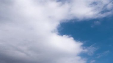 Clouds moving fast in the sky. Seamless loop timelapse
