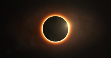 Total solar eclipse with diamond ring effect. The moon passes between the Sun and the Earth