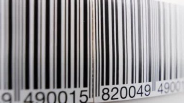 Barcode. Product code label on a conveyor belt. Production line, close up shot